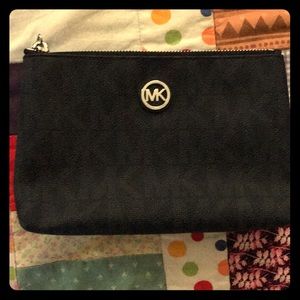 Black Michael Kors cosmetic bag.